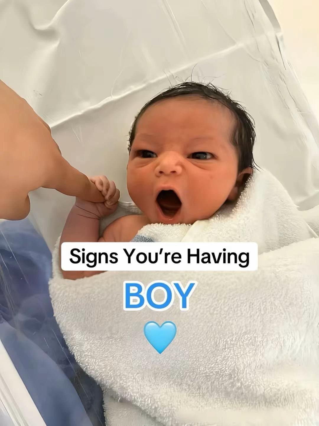 Slide 1: Signs You're Having
BOY
💙